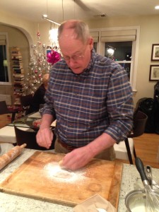 Bud Eichorn rolling roshky dough in powdered sugar.