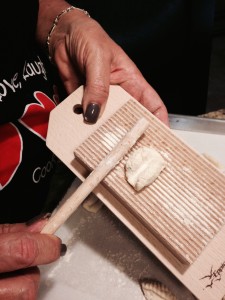 Flour paddle and dowel before rolling gnocchi