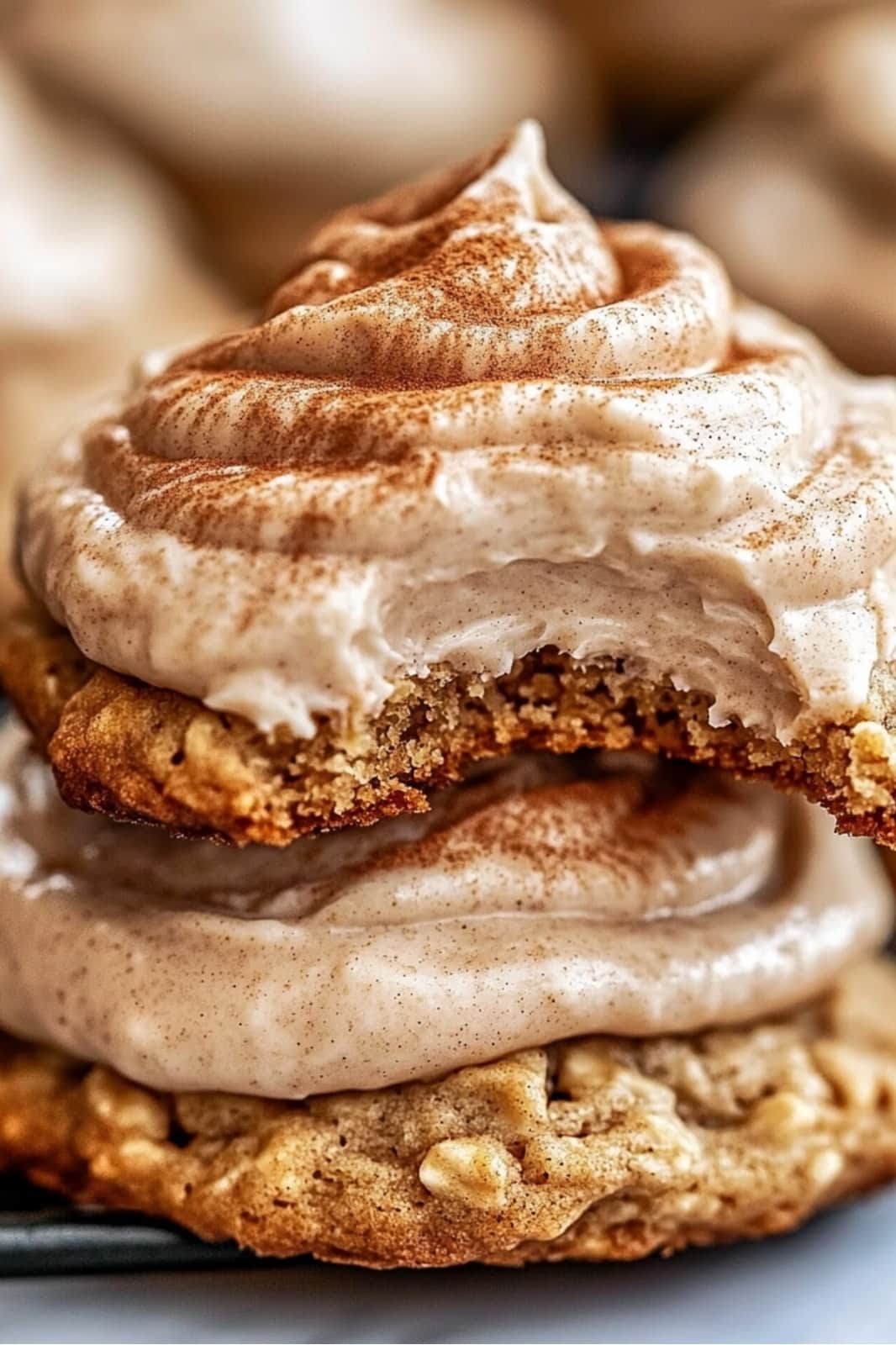 These Pumpkin Oatmeal Cookies with Cinnamon Cream Cheese Frosting are the perfect fall treat! Soft and spiced with pumpkin and oats, topped with a rich cinnamon frosting.