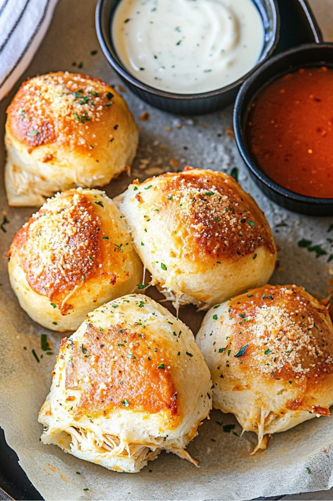 These Buffalo Chicken Bombs recipe is packed with spicy pulled chicken and gooey cheese, wrapped in biscuits and baked to perfection. Serve with blue cheese dressing for the ultimate appetizer! Ready in just over 5 hours.