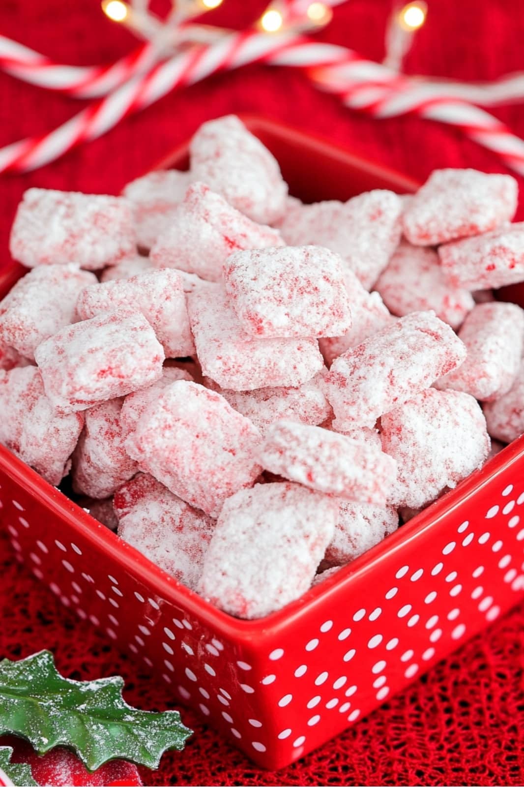 This Candy Cane Peppermint Puppy Chow recipe is a festive holiday treat! Chex cereal coated in peppermint baking chips, powdered sugar, and crushed candy canes makes a perfect Christmas snack.