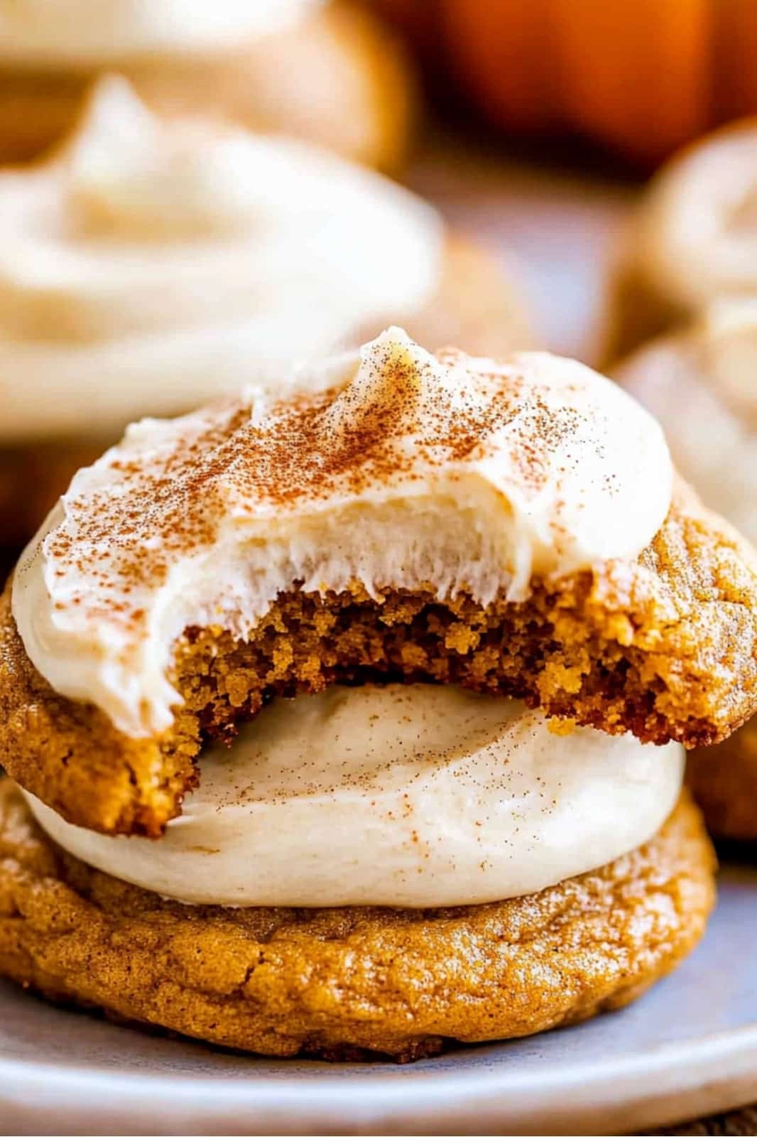 These Pumpkin Cookies with Cinnamon Cream Cheese Frosting are a fall favorite! Soft, spiced pumpkin cookies topped with creamy cinnamon frosting for a perfect autumn treat.