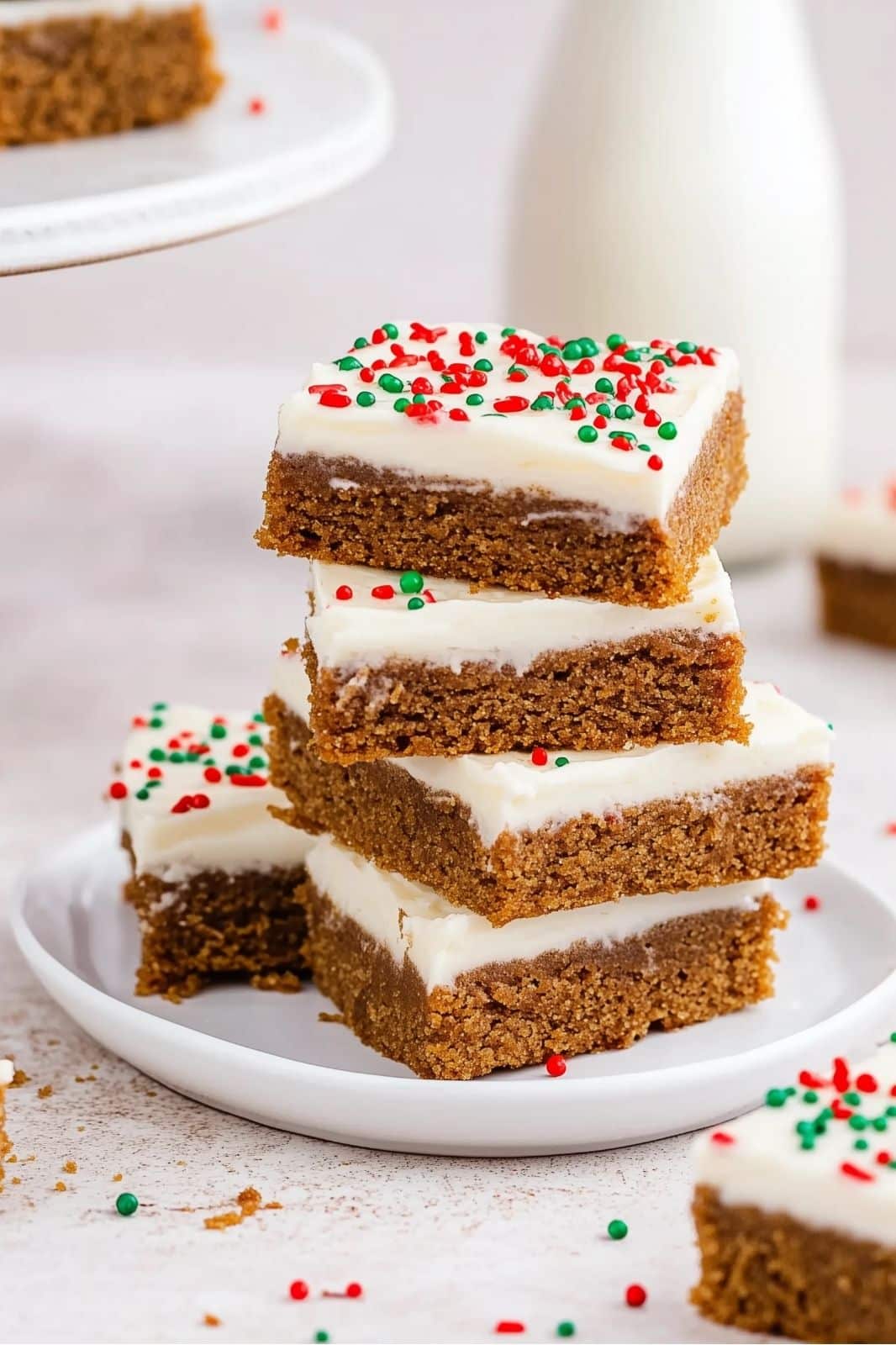 These Chewy Gingerbread Bars Recipe topped with cream cheese frosting are the perfect holiday treat! Full of warm spices like cinnamon, ginger, and cloves, these easy-to-make bars are a festive delight for any Christmas gathering. Ready in just over an hour!