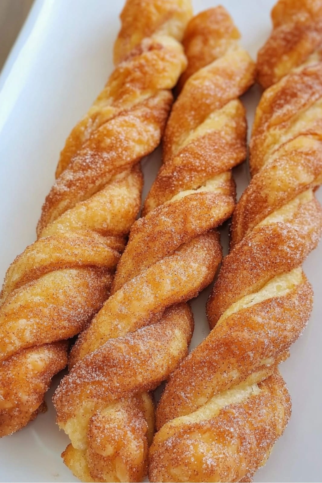 These Easy Pumpkin Pie Twists are a delicious fall treat made with crescent roll dough and a pumpkin spice filling. Perfect for a quick dessert or snack, ready in just 20 minutes!