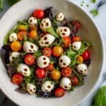 Halloween Salad with Mozzarella Skulls and Cherry Tomatoes Recipe