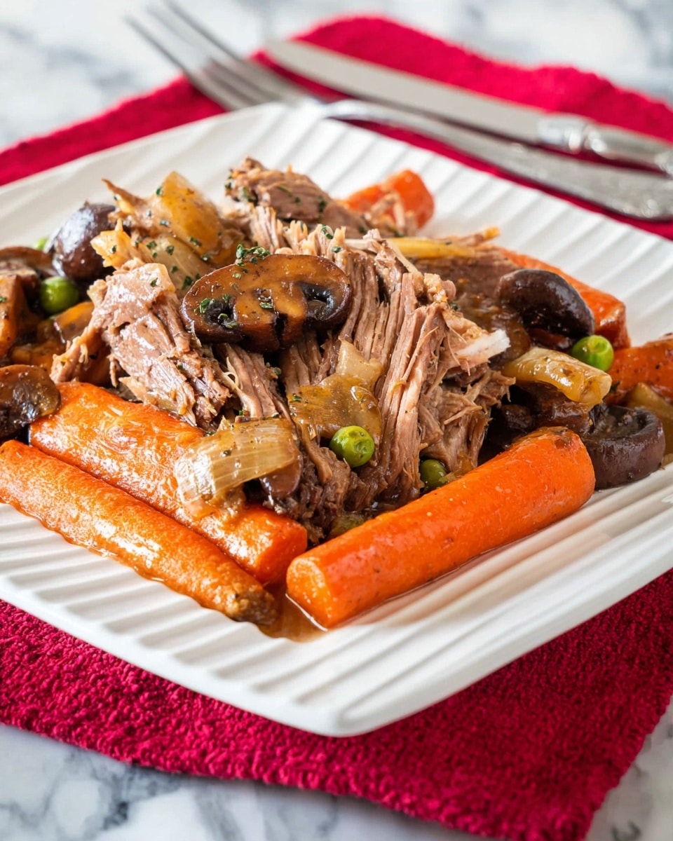 The dish is served on a white square plate with ridged edges. The bottom layer has whole orange carrots placed lengthwise. On top of the carrots, there are thick slices of brown, shredded meat covered in a light brown sauce. Scattered among the meat are cooked light brown mushrooms, green peas, and pieces of caramelized onions, adding texture and color contrast. A silver knife and fork are placed behind the plate on a white marbled surface with a red cloth in the background. Photo taken with an iphone --ar 4:5 --v 7