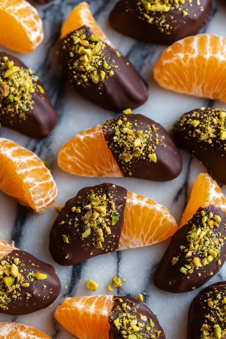 Chocolate Dipped Mandarin Slices Recipe 8 The image shows multiple tangerine segments arranged on a white marbled surface. Each segment has a bright orange color with a textured, slightly translucent peel showing natural fruit details. About half of each segment is dipped in dark chocolate, which is smooth and shiny, covering the top part. On the chocolate layer, crushed green pistachios are sprinkled, adding a rough texture and a touch of greenish-yellow color. The segments are evenly spread out in rows, with some segments fully covered by chocolate and pistachios and others plain orange. photo taken with an iphone --ar 2:3 --v 7 - Chocolate Dipped Mandarin Slices, simple citrus dessert, easy fruit chocolate treats, quick healthy snacks, homemade chocolate fruit dip