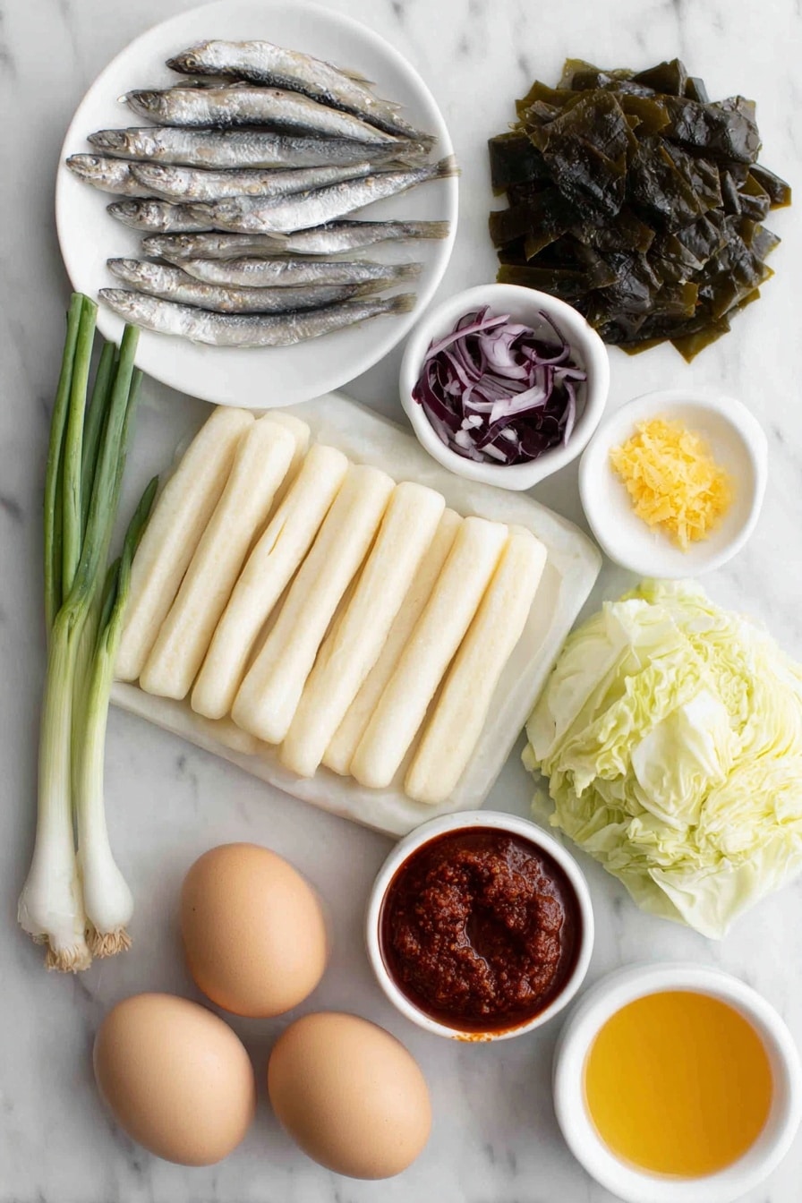 Flat lay of fresh tteokbokki rice cakes, rectangular pale white rice cakes about 3 inches long arranged neatly; two rectangular sheets of beige fish cake cut into strips; a small pile of roughly chopped green cabbage leaves with fresh vein details; two whole scallions with bright green tops and white bulbs; a small mound of minced raw garlic cloves; a few medium dried anchovies with silvery scales; a square piece of dried kelp with a dark green textured surface; thin slices of pale purple onion; a small white ceramic bowl filled with vibrant red gochujang paste; a small white ceramic bowl holding bright red finely ground gochugaru powder; a small white ceramic bowl containing dark brown soy sauce; a small white ceramic bowl with golden corn syrup; two whole uncracked boiled eggs with smooth brown shells placed side by side, all items arranged with perfect symmetry and balanced proportions, placed on a clean white marble surface, soft natural light, photo taken with an iPhone, professional food photography style, fresh ingredients, white ceramic bowls, no bottles, no duplicates, no utensils, no packaging --ar 2:3 --v 7 --p m7354615311229779997 - Spicy Tteokbokki Rice Cakes, Korean street food recipe, spicy rice cake dish, homemade tteokbokki, Korean cuisine favorites