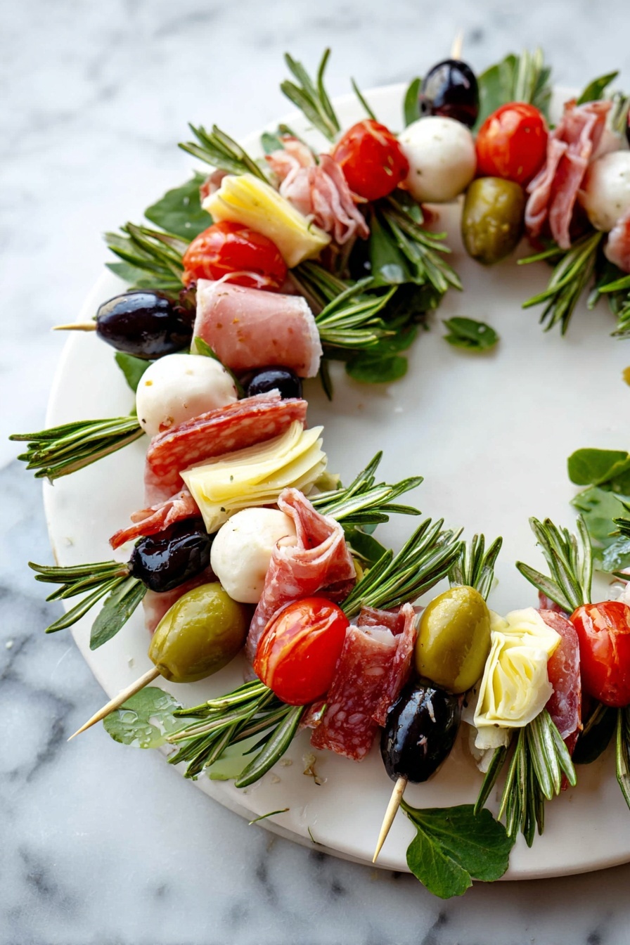 Charcuterie Wreath Platter Recipe 6 A round wreath made of many small skewers layered closely together on a white plate. Each skewer has a green rosemary sprig at the base, topped with a folded slice of pink salami, a pale yellow artichoke heart piece, a white soft mozzarella ball, a black olive, a green olive stuffed with red, a bright red cherry tomato, and a small green pickle. The colors are red, green, white, and black, with fresh green leaves scattered for decoration. The plate is on a white marbled surface. photo taken with an iphone --ar 2:3 --v 7 - Charcuterie Wreath Platter, festive appetizer ideas, edible centerpiece, cheese and meat platter, party appetizer presentation