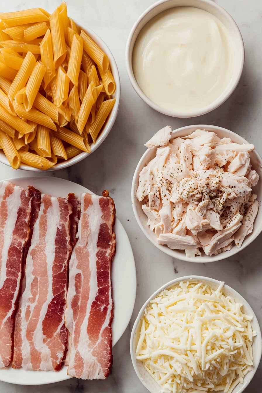 Chicken Bacon Ranch Casserole Recipe 7 Flat lay of uncooked penne pasta in a simple white ceramic bowl, six thick-cut raw bacon strips arranged neatly on a white plate, a small white bowl filled with creamy Alfredo sauce, a small white bowl containing ranch seasoning powder, shredded rotisserie chicken piled on a white plate, shredded fresh mozzarella cheese in a white bowl, all placed on a clean white marble surface, soft natural light, photo taken with an iPhone, professional food photography style, fresh ingredients, white ceramic bowls, no bottles, no duplicates, no utensils, no packaging --ar 2:3 --v 7 --p m7354615311229779997 - Chicken Bacon Ranch Casserole, easy chicken casserole, creamy bacon pasta bake, ranch chicken bake, comforting chicken dinner