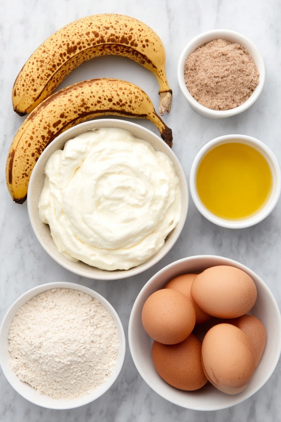 Banana Yogurt Pancakes Recipe 7 Flat lay of two ripe bananas with natural brown spots, a small white ceramic bowl filled with creamy natural yogurt, two large whole uncracked brown eggs, a small white ceramic bowl of golden cooking oil, a neat pile of whole wheat flour, and a small white ceramic bowl containing fine baking powder, all arranged with perfect symmetry on a clean white marble surface, soft natural light, photo taken with an iPhone, professional food photography style, fresh ingredients, white ceramic bowls, no bottles, no duplicates, no utensils, no packaging --ar 2:3 --v 7 --p m7354615311229779997 - Banana Yogurt Pancakes, healthy banana pancakes, fluffy banana pancakes, easy breakfast recipes, quick pancake ideas