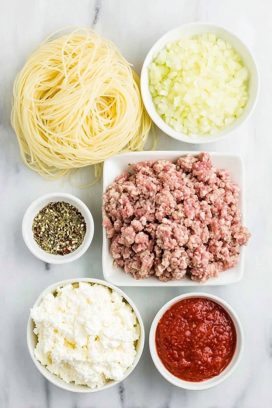 Million Dollar Spaghetti Bake Recipe 7 Flat lay of uncooked spaghetti noodles neatly coiled, a portion of raw Italian sausage meat freshly ground, a small white ceramic bowl filled with finely chopped yellow onion, a few peeled garlic cloves minced and spread beside, a small white bowl holding bright red crushed red pepper flakes, two simple white bowls filled with rich red marinara sauce, a mound of shredded fresh mozzarella cheese, one block of smooth cream cheese, a small white bowl with creamy ricotta cheese, a small white bowl containing freshly grated parmesan cheese, a sprinkle of dried oregano, a small white bowl with garlic powder, whole uncracked brown eggs, all arranged symmetrically and balanced on a clean white marble surface, soft natural light, photo taken with an iPhone, professional food photography style, fresh ingredients, white ceramic bowls, no bottles, no duplicates, no utensils, no packaging --ar 2:3 --v 7 --p m7354615311229779997 - Million Dollar Spaghetti Bake, cheesy Italian casserole, easy comfort food recipes, family favorite pasta bake, savory sausage spaghetti