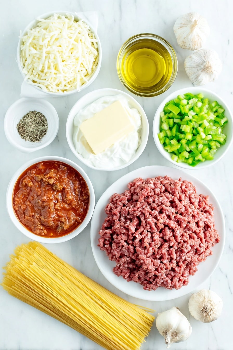 Creamy Alfredo and Spaghetti Bake Recipe 7 Flat lay of a small white ceramic bowl of golden olive oil, a cup of freshly chopped white onion, a small pile of bright green chopped bell pepper, a small white bowl filled with minced garlic cloves, a portion of raw ground beef with a rich red color, a few small piles of coarse salt and cracked black peppercorns, a small heap of dried Italian seasoning herbs, two small white bowls containing rich red spaghetti sauce, a neat bundle of uncooked golden-yellow spaghetti pasta, a half-stick of pale yellow butter on a white ceramic plate, four whole uncracked brown garlic bulbs, a small white bowl of fine white all-purpose flour, a small white bowl of thick heavy cream, chunks of fresh grated parmesan cheese on white ceramic, and a pile of shredded mozzarella cheese all arranged symmetrically on a clean white marble surface, soft natural light, photo taken with an iPhone, professional food photography style, fresh ingredients, white ceramic bowls, no bottles, no duplicates, no utensils, no packaging --ar 2:3 --v 7 --p m7354615311229779997 - Creamy Alfredo and Spaghetti Bake, cheesy pasta casserole, baked Alfredo spaghetti, easy pasta bake recipe, family-friendly pasta dish