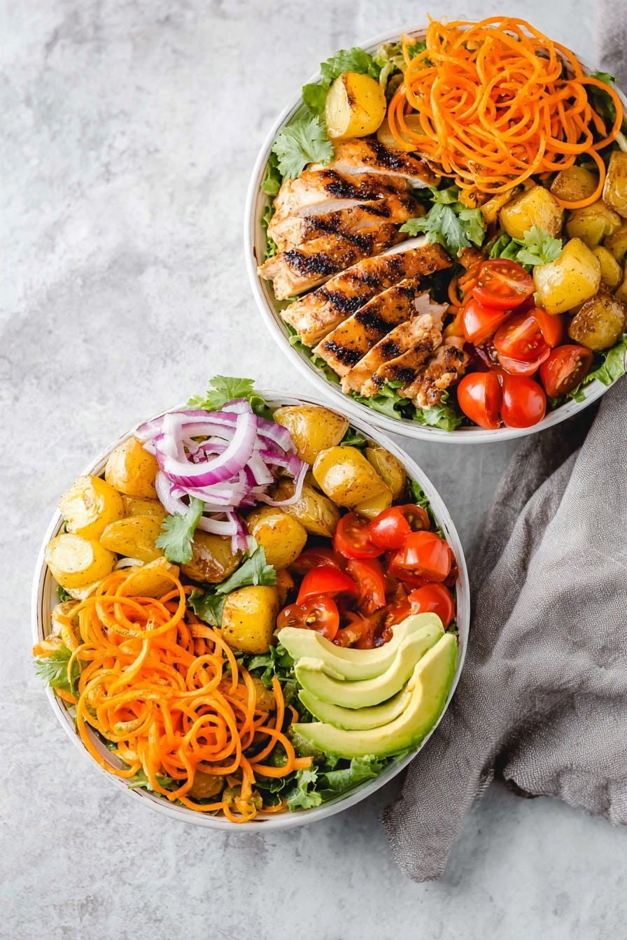 Hawaiian Chicken Salad Bowl Recipe 6 Two white bowls filled with layered salad sit on a white marbled surface with a light gray cloth nearby. Each bowl contains a base of fresh green lettuce leaves, topped with bright orange spiralized sweet potatoes on one side. On top, there are pieces of grilled chicken with char marks, arranged in slices. Around the chicken in the bowls are yellow roasted potatoes, red grape tomato halves, and thin purple rings of red onion. One bowl also shows slices of light green avocado and sprigs of fresh cilantro adding texture. The overall look is colorful with warm and fresh tones, presented clearly from above. photo taken with an iphone --ar 2:3 --v 7 - Hawaiian Chicken Salad Bowl, tropical chicken salad, healthy Hawaiian chicken bowl, grilled chicken pineapple salad, easy Hawaiian dinner