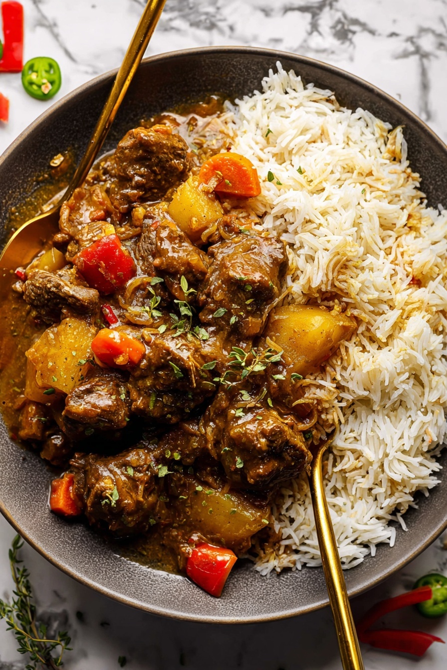 Jamaican Curry Chicken Recipe 8 A round white plate sits on a white marbled surface, filled with two main layers. The bottom layer is a bed of fluffy white rice with soft, separate grains. On top, there is a rich stew made of dark brown pieces of meat coated in thick sauce with visible chunks of yellow potatoes, orange carrots, and red pepper bits. The stew covers most of the rice, and the sauce has a shiny texture that makes the ingredients look moist and tender. Two gold-colored spoons rest inside the plate on opposite sides, slightly inserted into the rice and stew. Small green herb sprigs and green and red peppers are scattered around the plate on the background. Photo taken with an iphone --ar 2:3 --v 7 - Jamaican Curry Chicken, Jamaican Curry Chicken authentic, Jamaican curry chicken recipe, Caribbean chicken curry, spicy Jamaican chicken