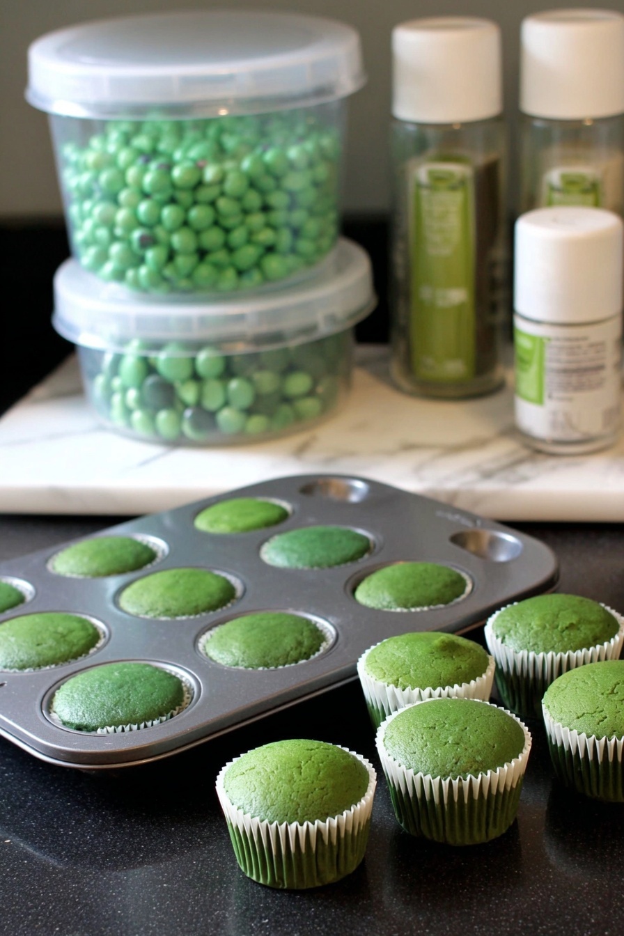Green Velvet Cake with Cream Cheese Frosting Recipe 6 A single round cake with a bright green top layer that looks soft and slightly bubbly, sitting in a white cake pan placed on an oven rack with metal bars, the cake surface slightly domed with some small holes and a few cracks in the middle, the photo taken against a white marbled texture background. photo taken with an iphone --ar 2:3 --v 7 - Green Velvet Cake with Cream Cheese Frosting, vibrant green cake recipe, easy green velvet cake, homemade green velvet cake, festive green layer cake