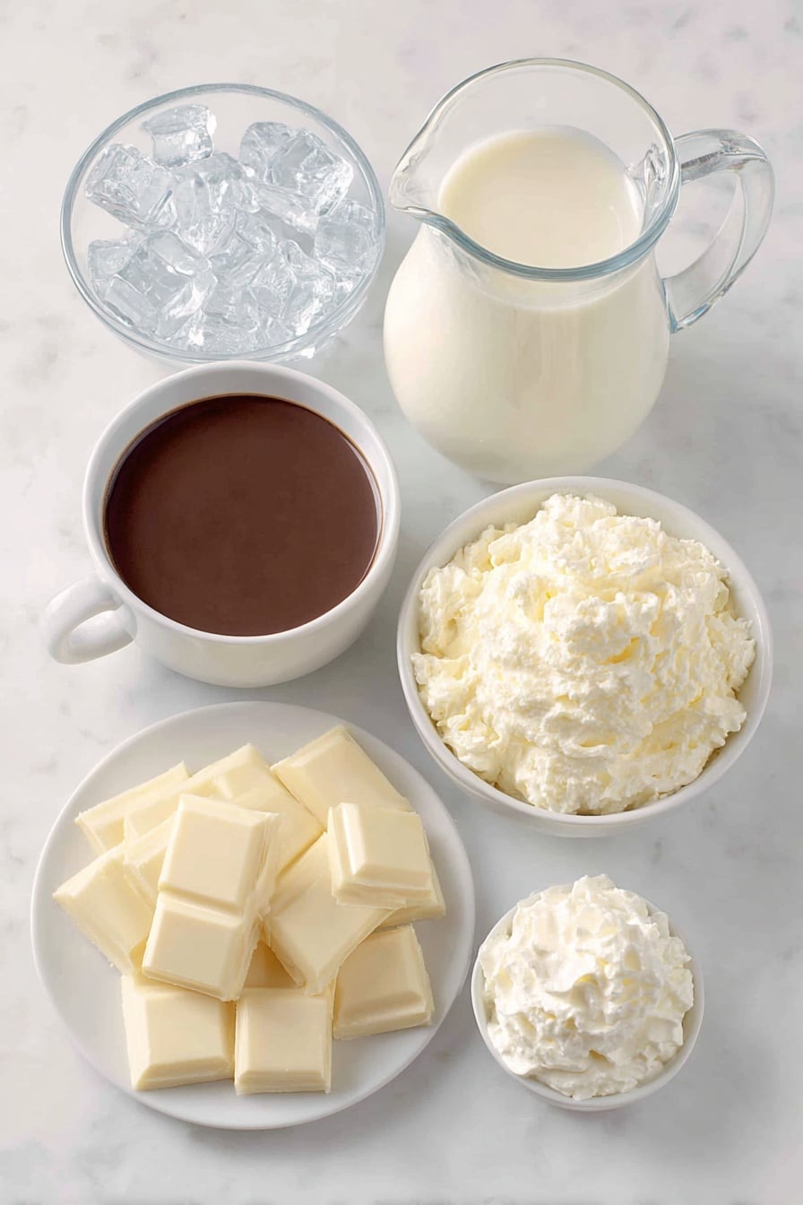 Copycat Iced White Chocolate Mocha Recipe 7 Flat lay of a small white ceramic bowl of rich dark espresso, a glass pitcher of fresh cold milk, a small white ceramic bowl filled with smooth white chocolate sauce, a handful of clear ice cubes neatly arranged, and a dollop of fluffy fresh whipped cream on a simple white ceramic dish, all placed on a clean white marble surface, soft natural light, photo taken with an iPhone, professional food photography style, fresh ingredients, white ceramic bowls, no bottles, no duplicates, no utensils, no packaging --ar 2:3 --v 7 --p m7354615311229779997 - Copycat Iced White Chocolate Mocha, white chocolate mocha, iced coffee drinks, homemade Starbucks drinks, easy coffee recipes