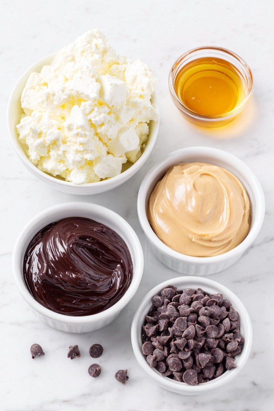 Creamy Cottage Cheese Ice Cream with Chocolate Recipe 7 Flat lay of a small mound of fresh full-fat cottage cheese, a small white ceramic bowl filled with golden honey, a small white ceramic bowl holding smooth creamy peanut butter, a small white ceramic bowl containing glossy dark chocolate chips, all arranged with perfect symmetry, placed on a clean white marble surface, soft natural light, photo taken with an iPhone, professional food photography style, fresh ingredients, white ceramic bowls, no bottles, no duplicates, no utensils, no packaging --ar 2:3 --v 7 --p m7354615311229779997 - Creamy Cottage Cheese Ice Cream with Chocolate, cottage cheese ice cream, healthy chocolate ice cream, easy homemade ice cream, protein-packed dessert